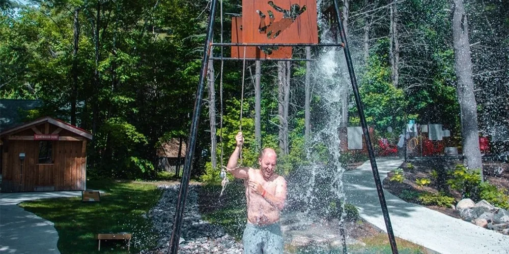 Man bathing in outdoor water spring at the Muskoka BeerSpa